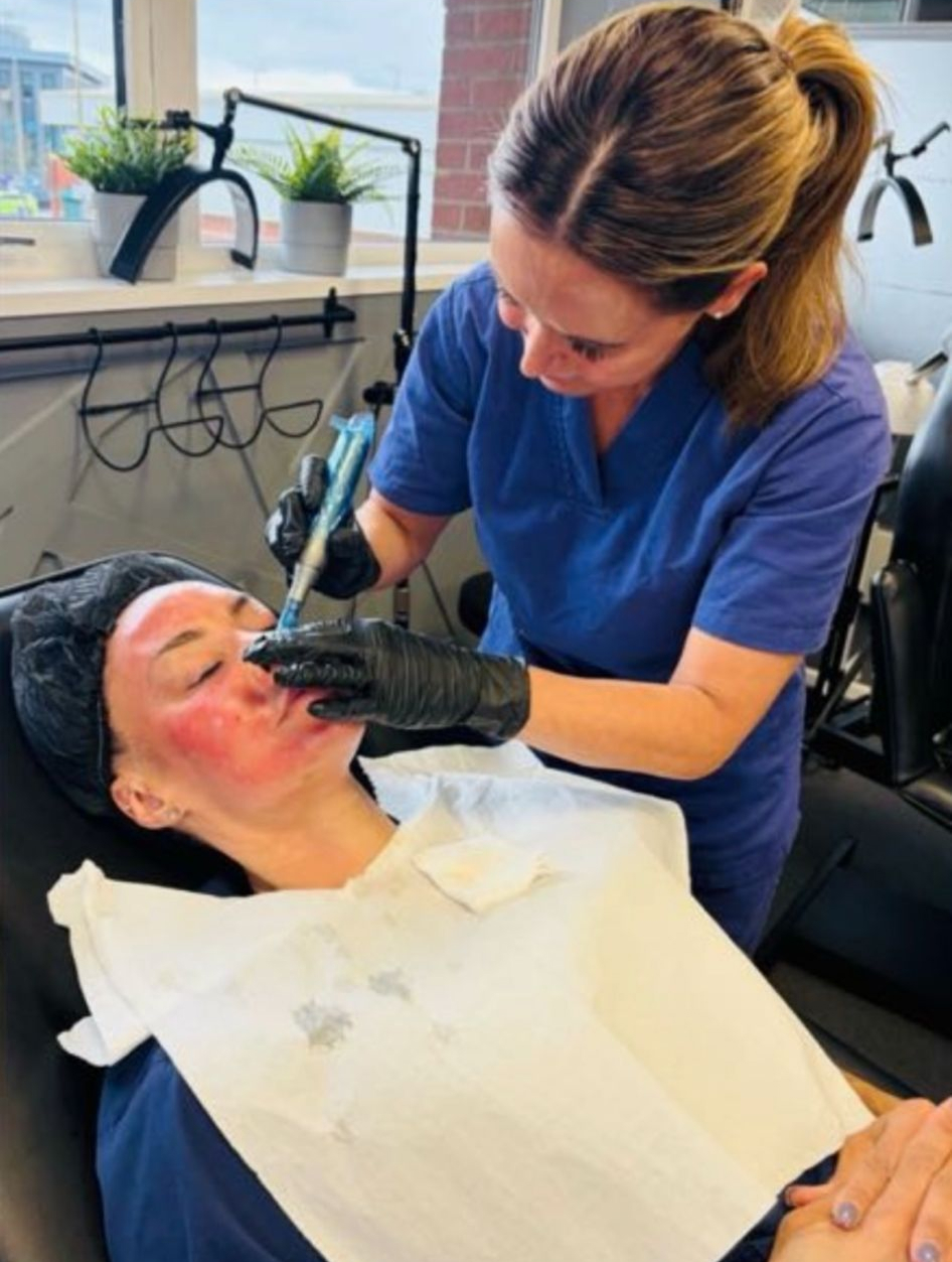 Caroline performing a facial treatment